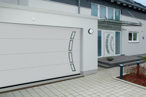 household front door with matching garage on front of european house in england UK